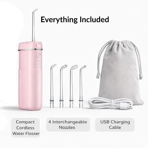 Pink cordless water flosser with interchangeable nozzles and USB charging cable on a white background.