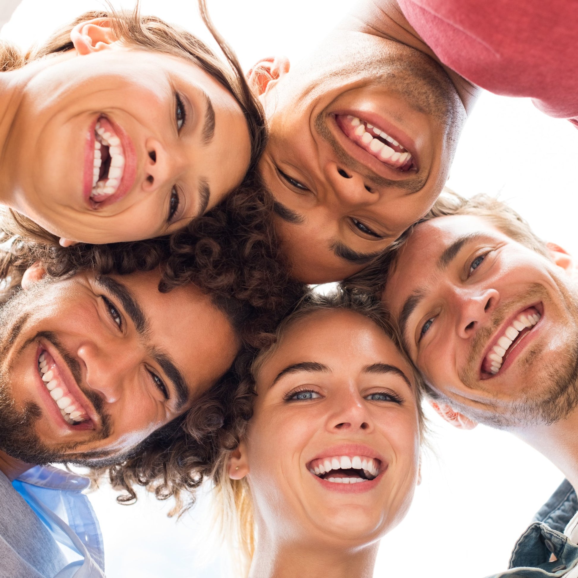 group of smiling people with white teeth
