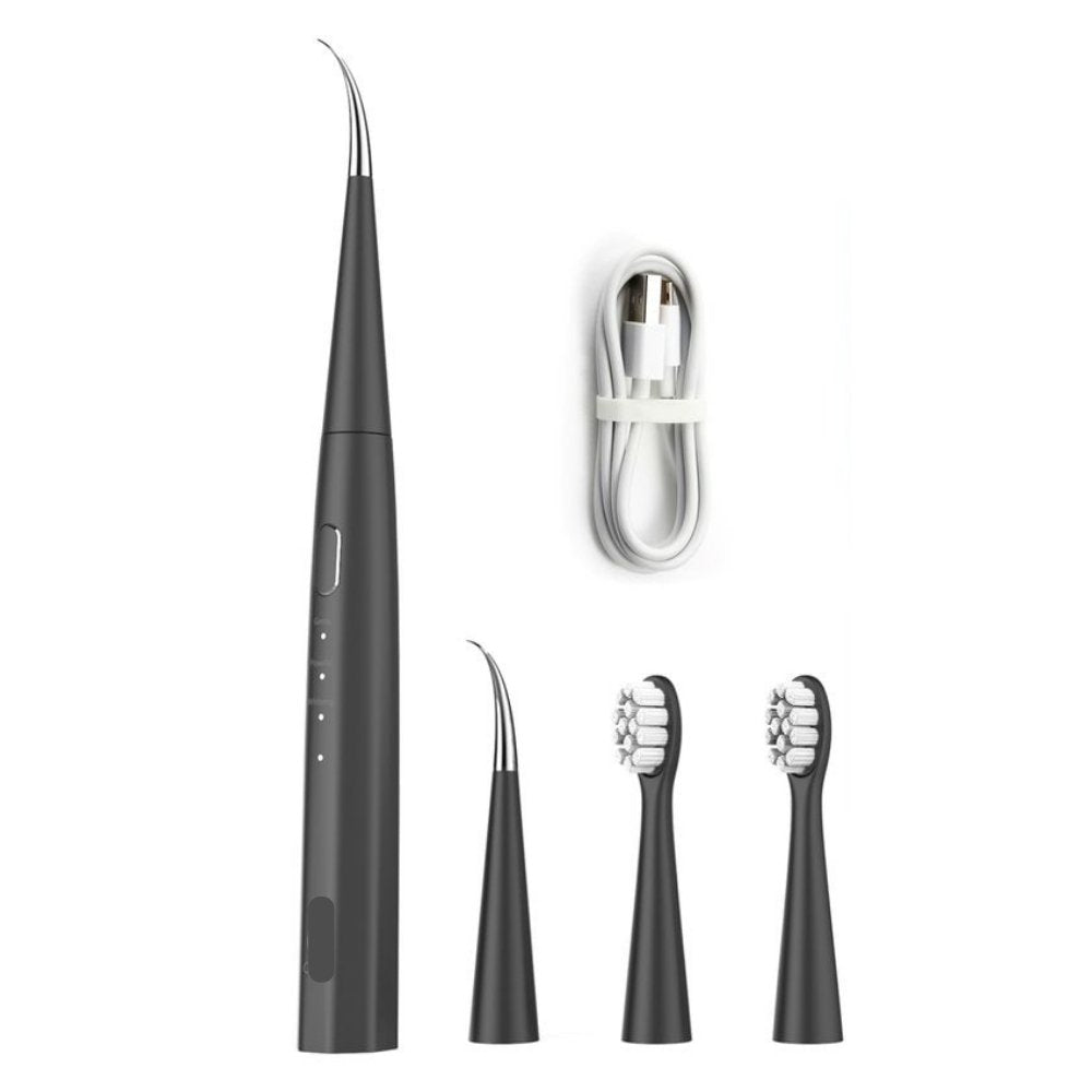 A set of dental tools including a toothbrush and various attachments for a sonic dental kit, with a USB cable for charging.
