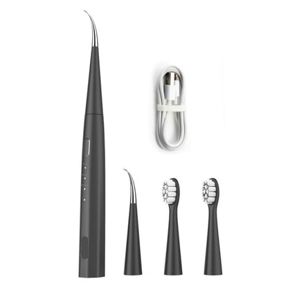 A set of dental tools including a toothbrush and various attachments for a sonic dental kit, with a USB cable for charging.